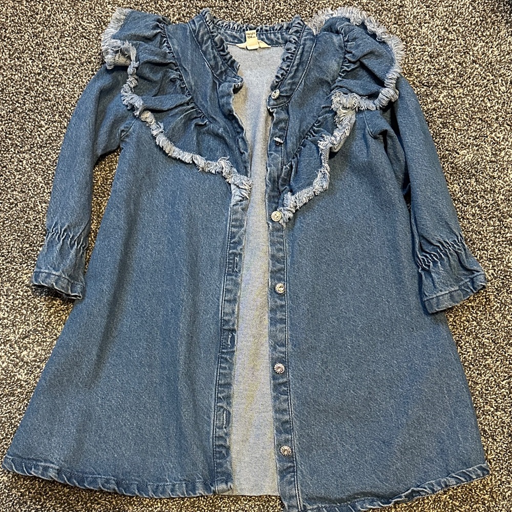 River Island girls denim dress with silver buttons and ruffles.